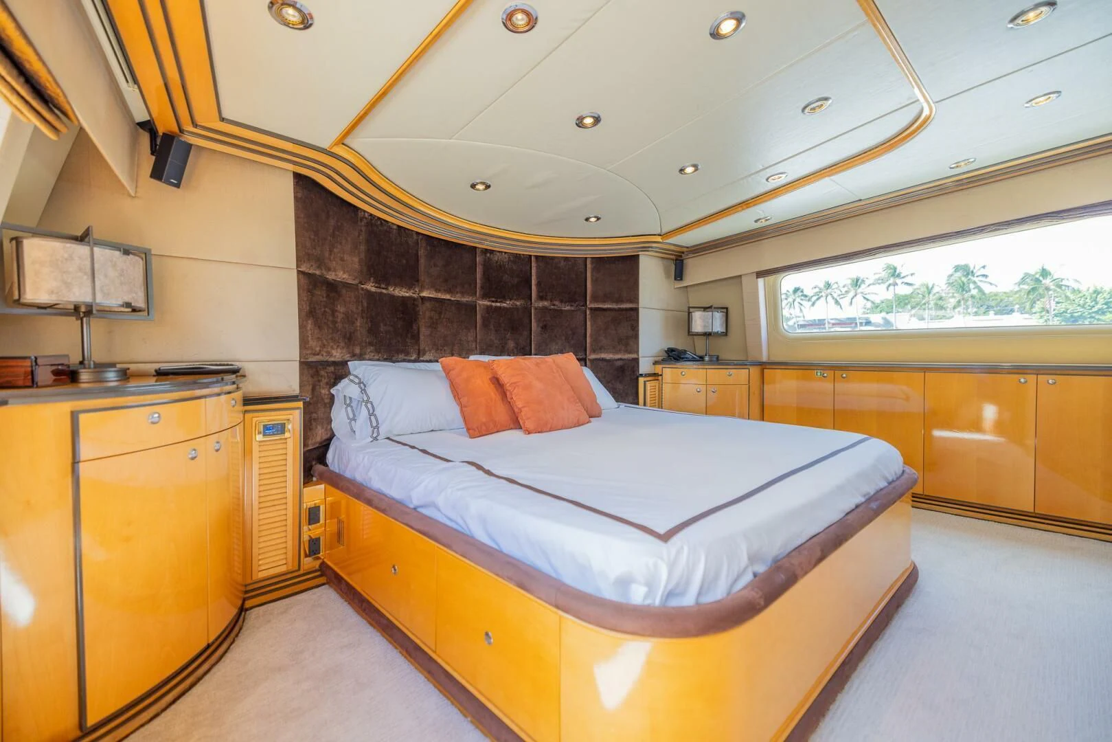 a bedroom with a bed aboard ENTOURAGE Yacht for Sale