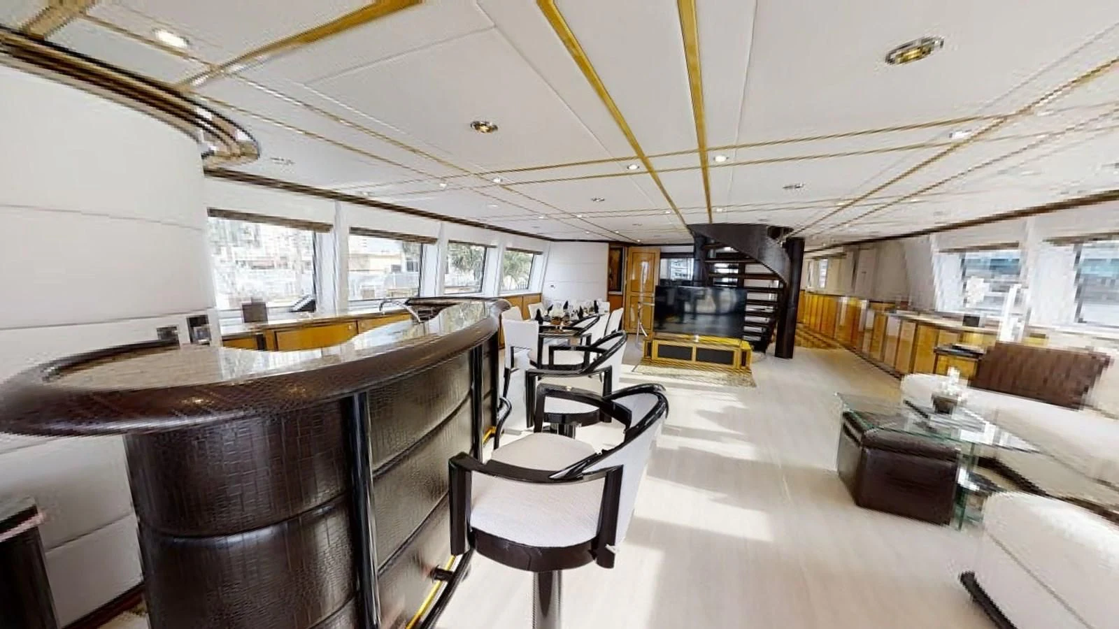 a room with a table and chairs aboard ENTOURAGE Yacht for Sale
