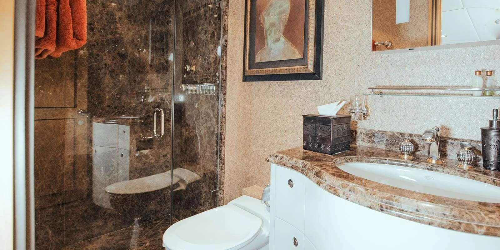 a bathroom with a marble shower curtain aboard ENTOURAGE Yacht for Sale