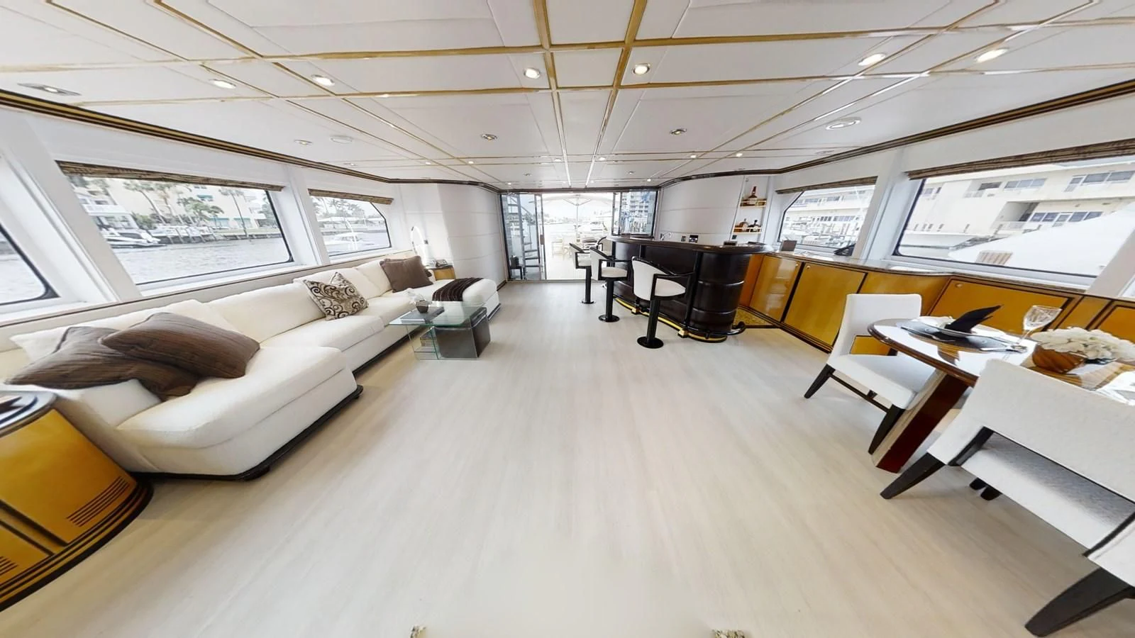 a room with a couch and a table and a couch aboard ENTOURAGE Yacht for Sale