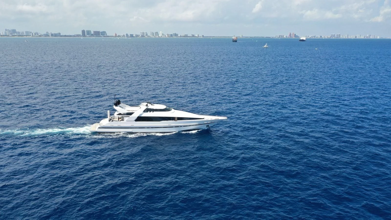 a white boat in the water aboard ENTOURAGE Yacht for Sale