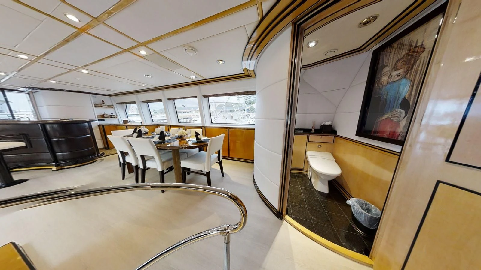 a room with a table and chairs aboard ENTOURAGE Yacht for Sale