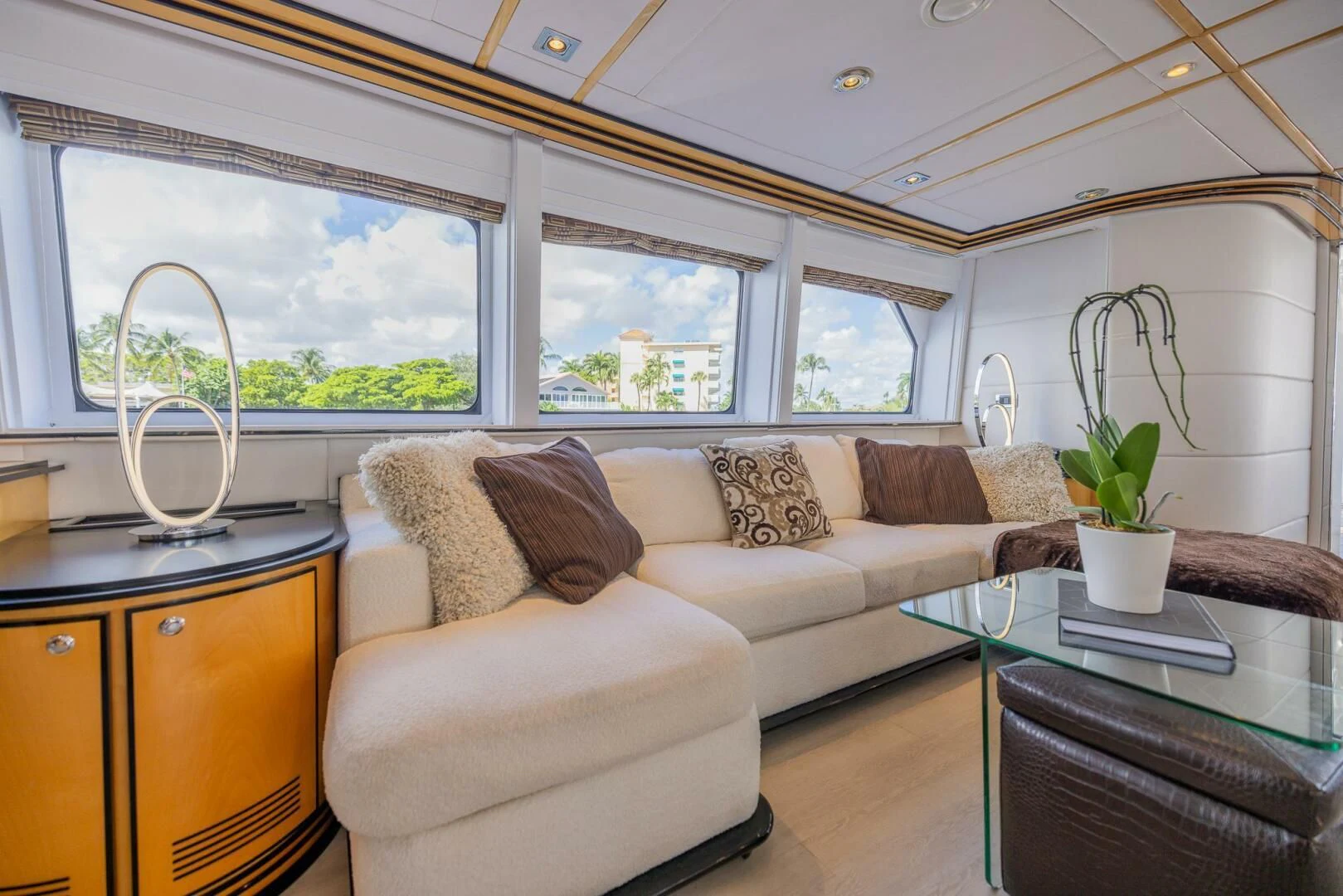 a living room with a couch and a coffee table aboard ENTOURAGE Yacht for Sale