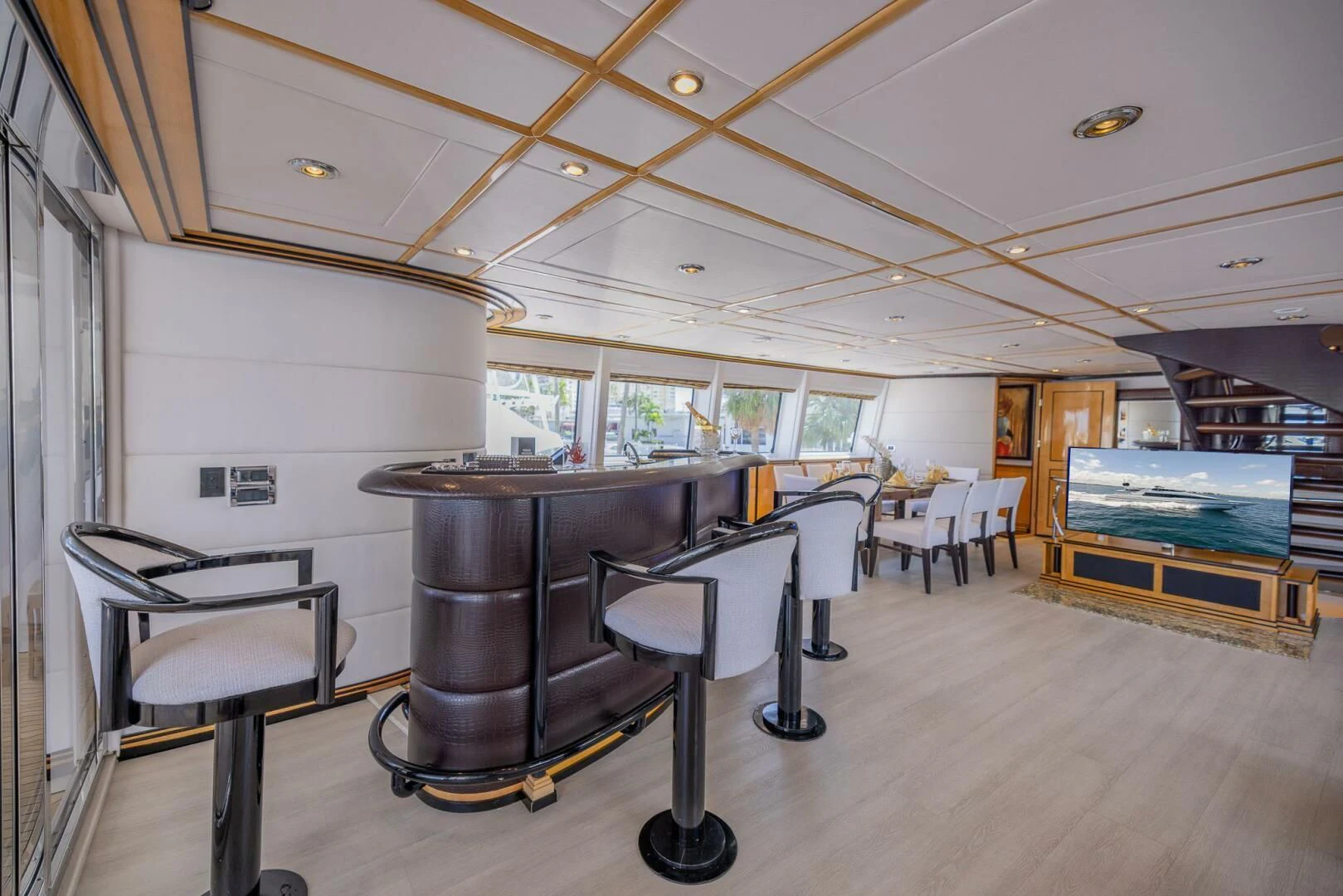 a room with a table and chairs aboard ENTOURAGE Yacht for Sale