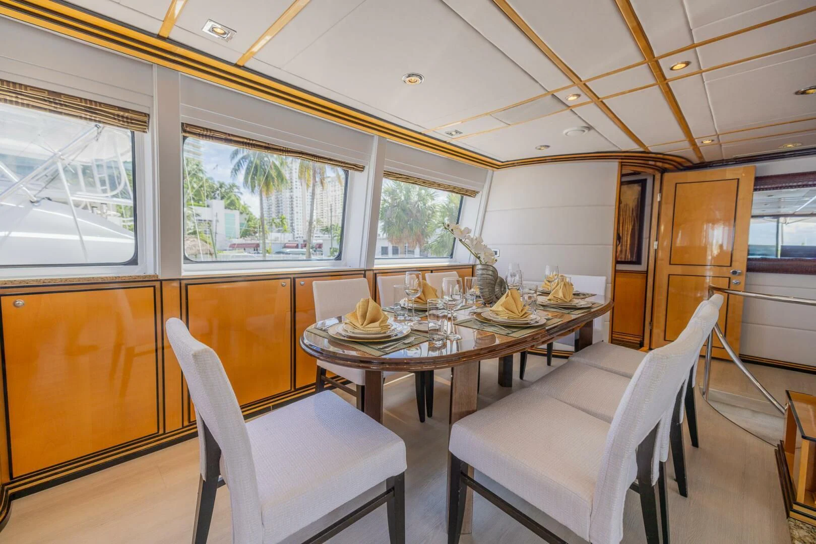 a dining room with a table and chairs aboard ENTOURAGE Yacht for Sale