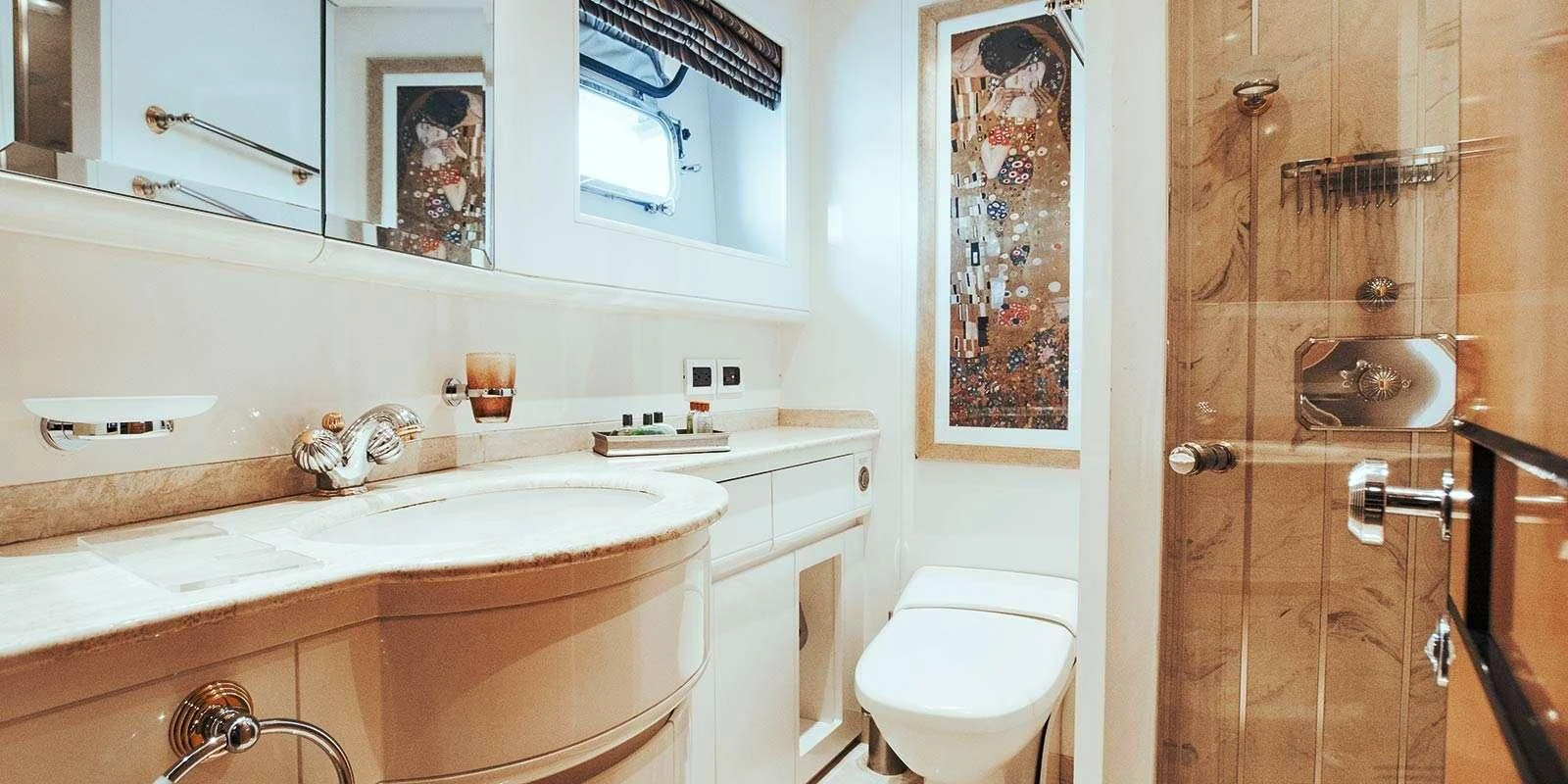 a bathroom with a sink and a toilet aboard ENTOURAGE Yacht for Sale