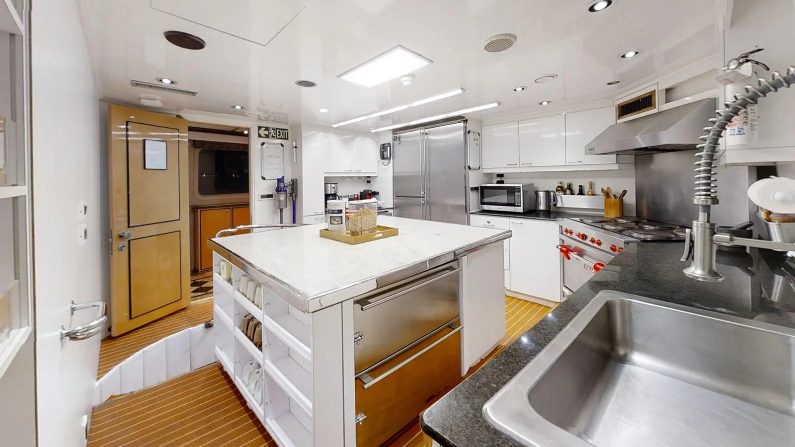 a kitchen with a stainless steel sink aboard ENTOURAGE Yacht for Sale