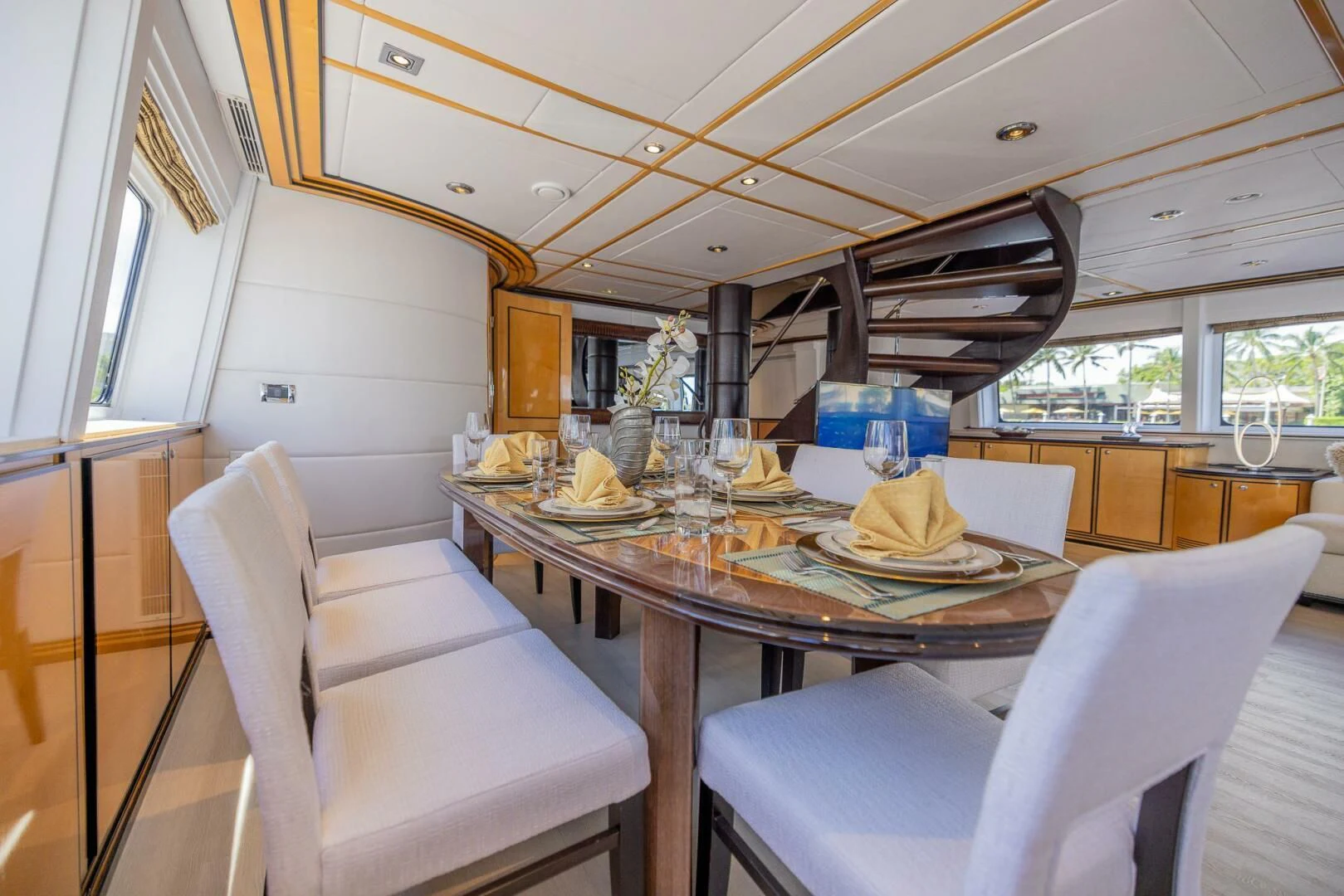 a dining table with a chair aboard ENTOURAGE Yacht for Sale