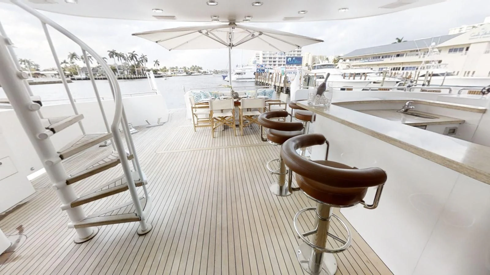 a boat dock with chairs aboard ENTOURAGE Yacht for Sale