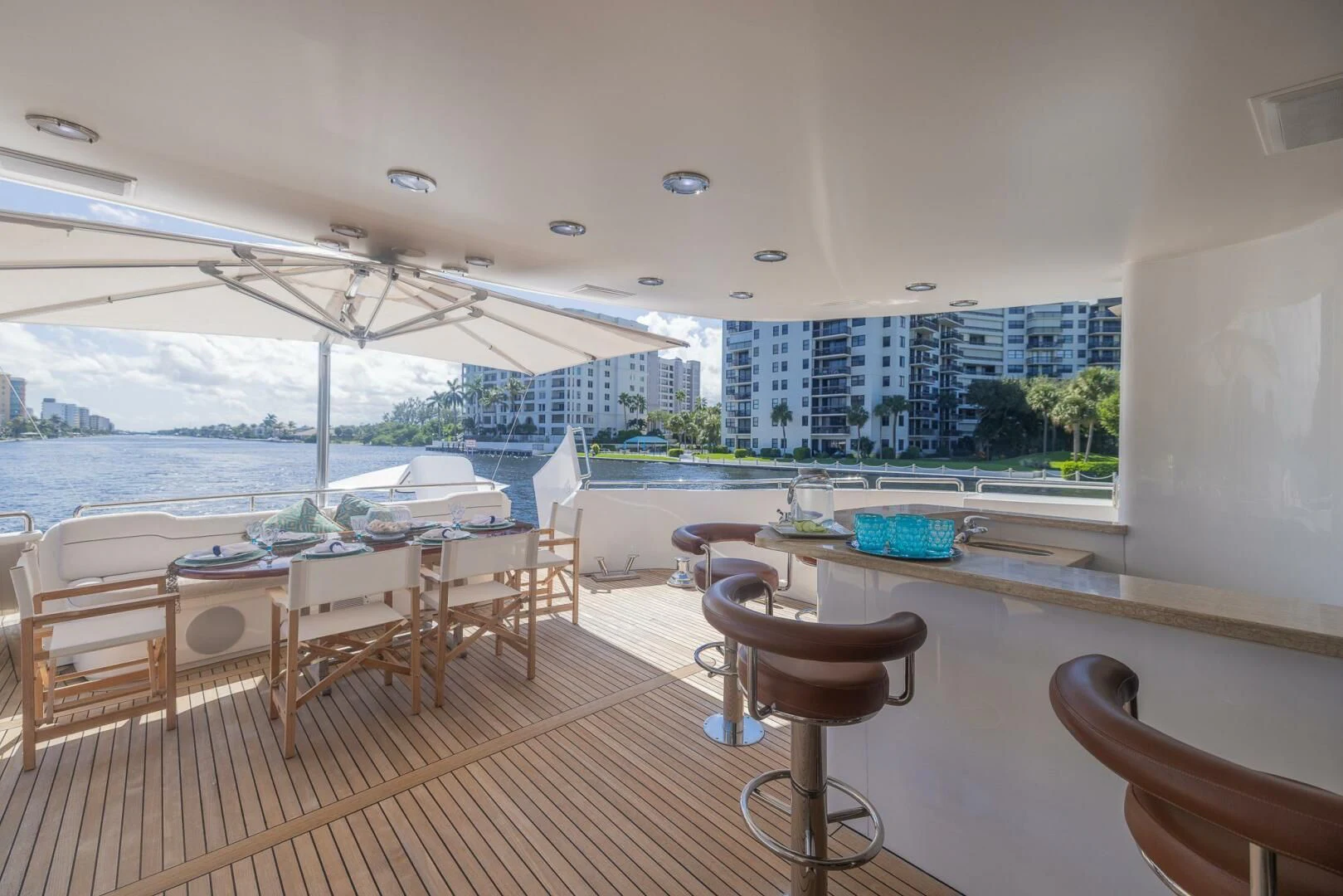a room with tables and chairs aboard ENTOURAGE Yacht for Sale