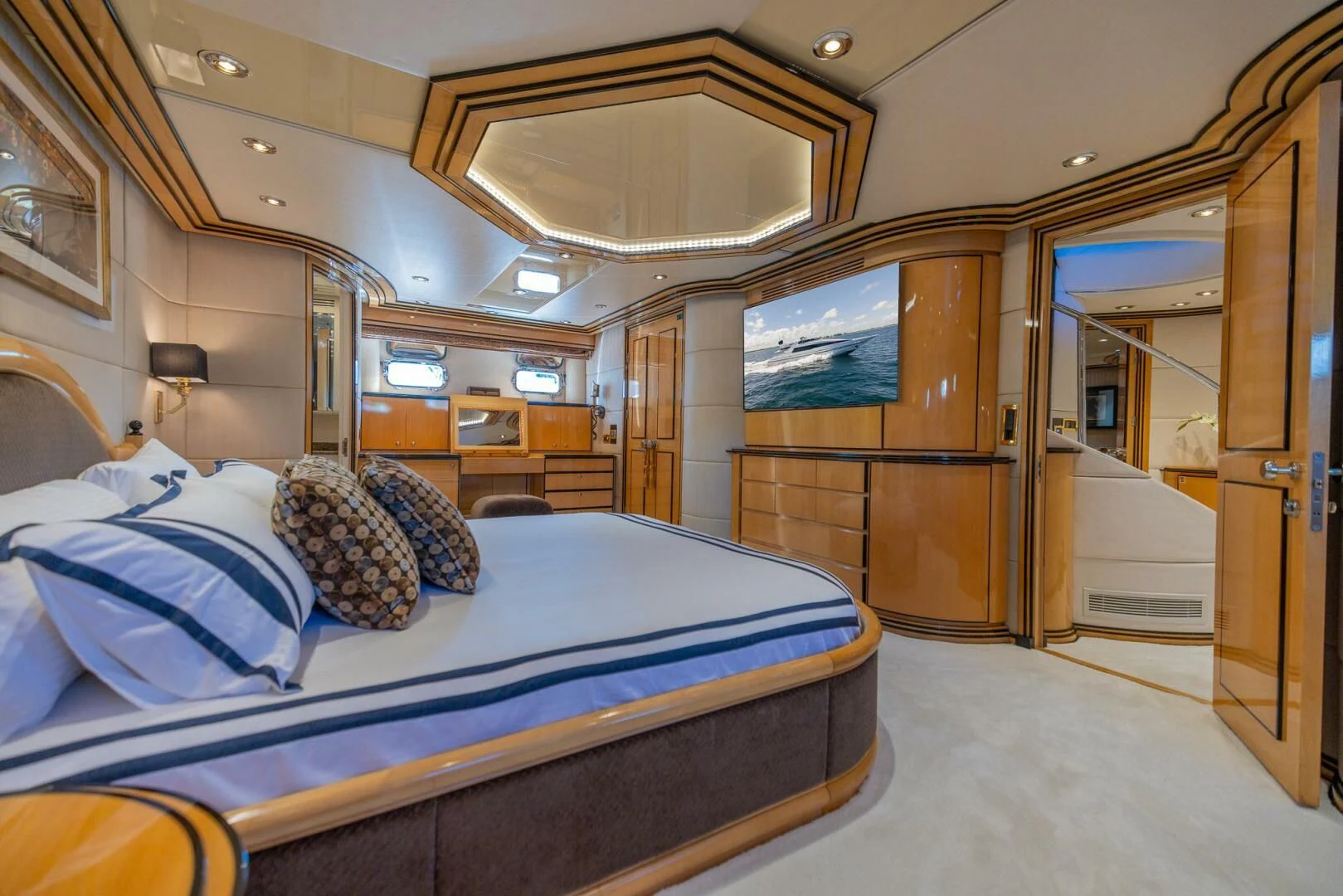a room with a bed and a mirror aboard ENTOURAGE Yacht for Sale