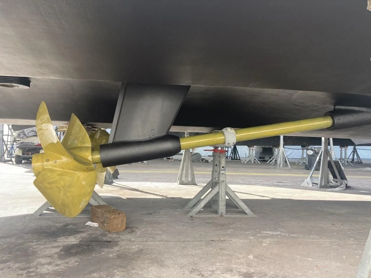 a yellow airplane on display aboard ENTOURAGE Yacht for Sale