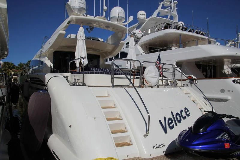 a white boat with a ladder on the deck aboard VELOCE Yacht for Sale