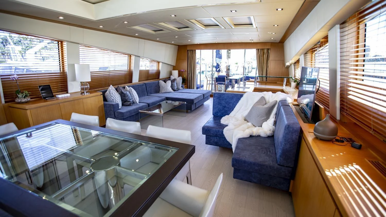 a living room with a large window aboard VELOCE Yacht for Sale