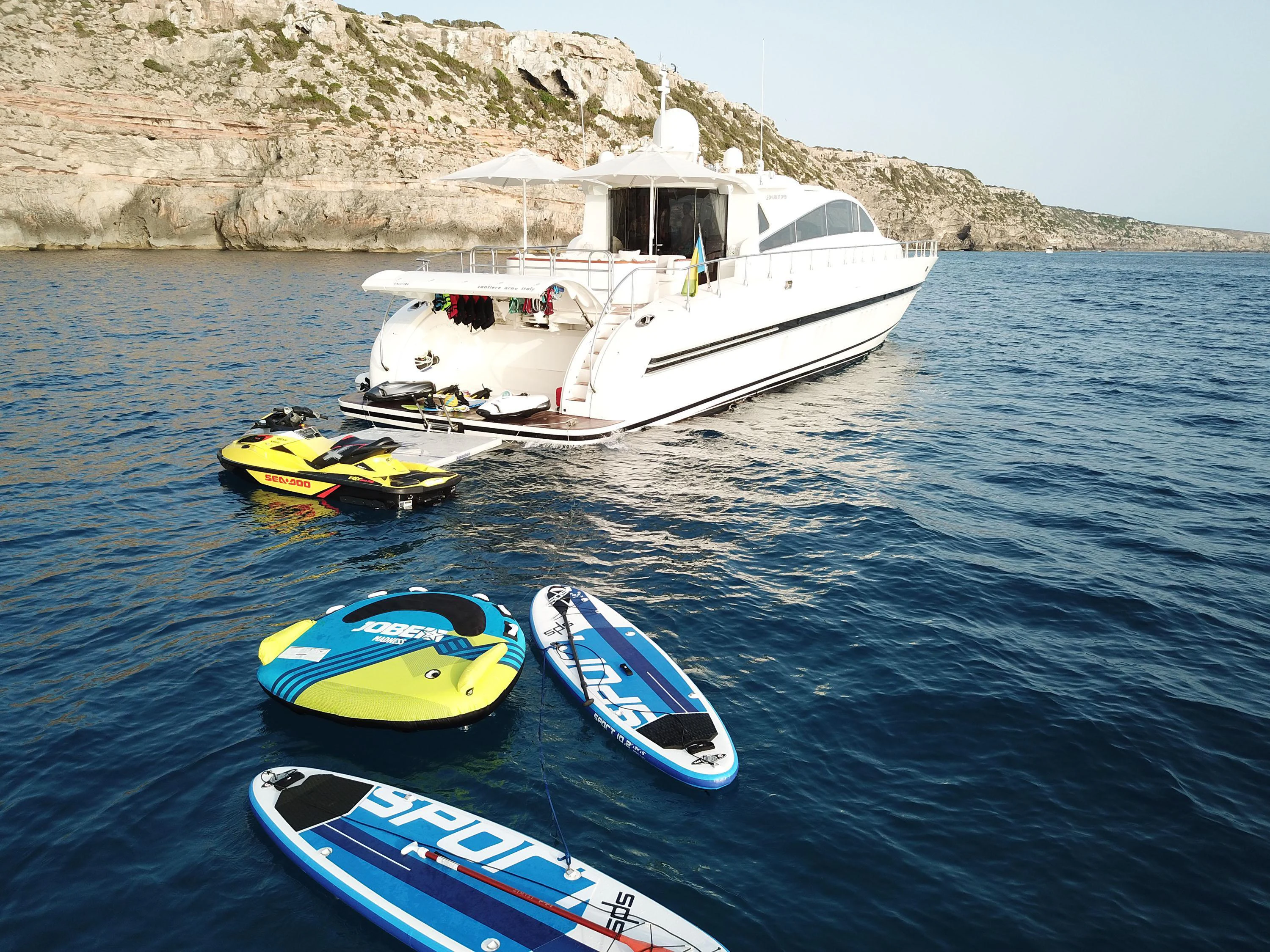 a boat and a kayak in the water aboard VELOCE Yacht for Sale