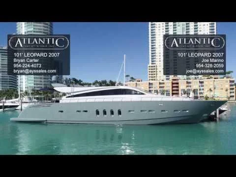 a white boat in a harbor aboard VELOCE Yacht for Sale
