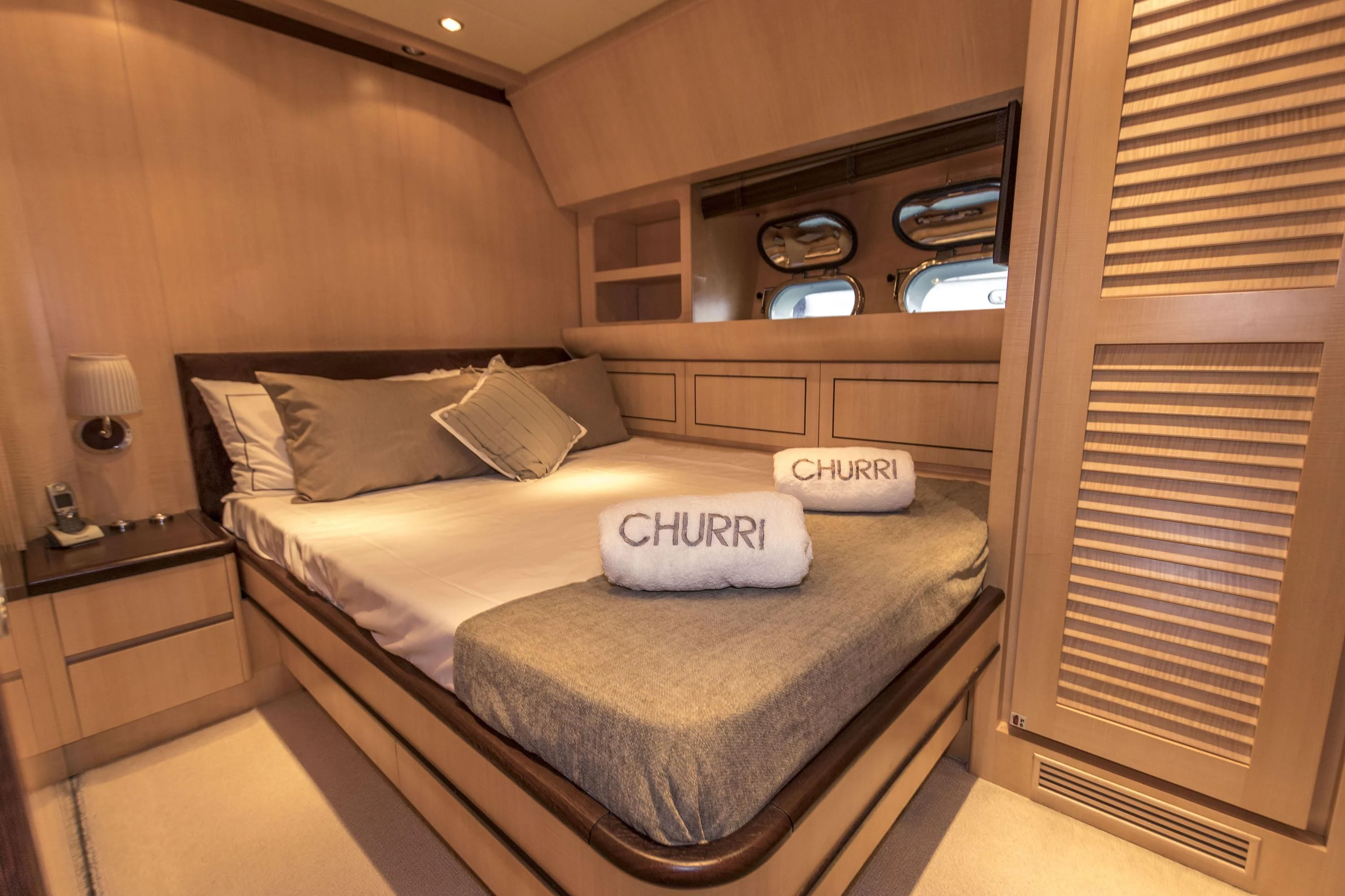 a bed with a white pillow aboard VELOCE Yacht for Sale