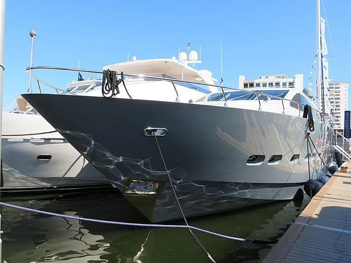 a boat docked at a pier aboard VELOCE Yacht for Sale