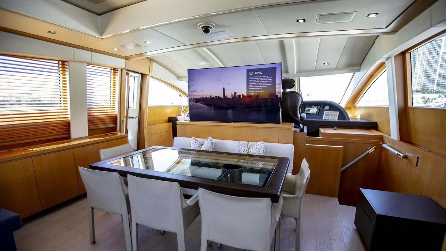a room with a table and chairs aboard VELOCE Yacht for Sale