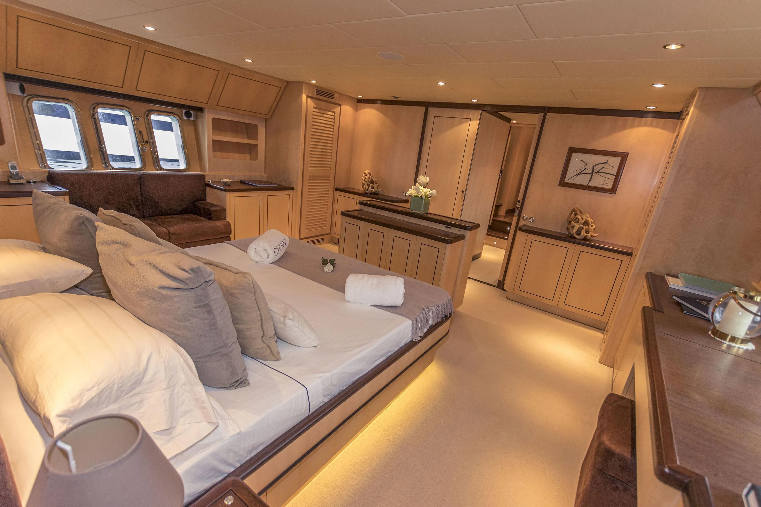 a large bedroom with a bed aboard VELOCE Yacht for Sale