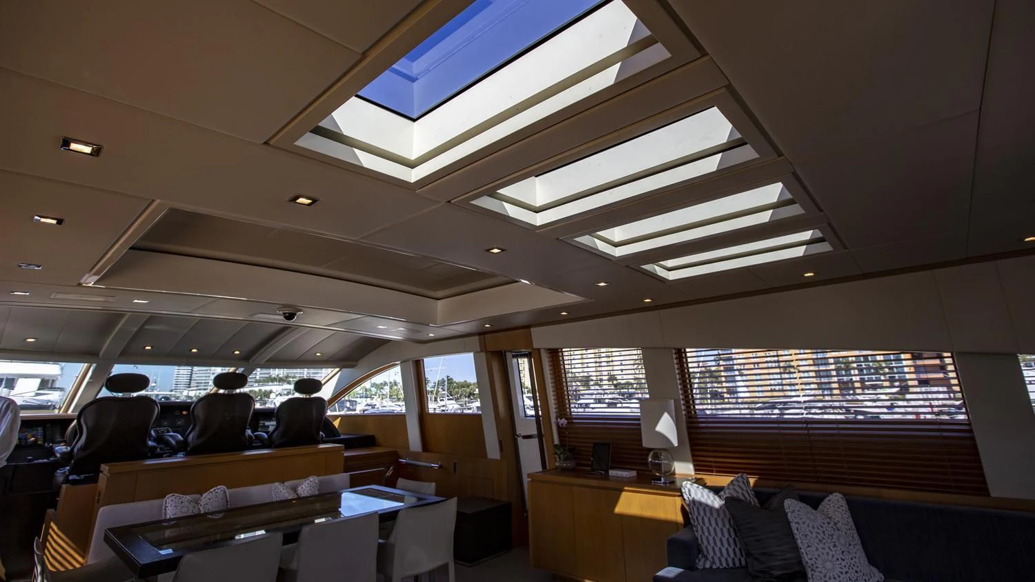 a room with chairs and a table aboard VELOCE Yacht for Sale