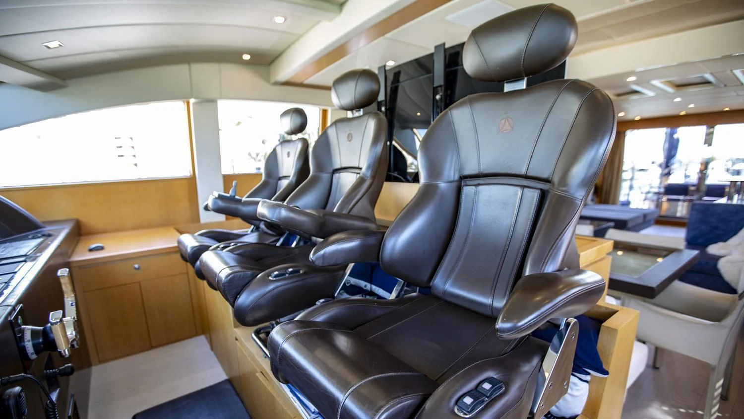 a room with chairs and a table aboard VELOCE Yacht for Sale