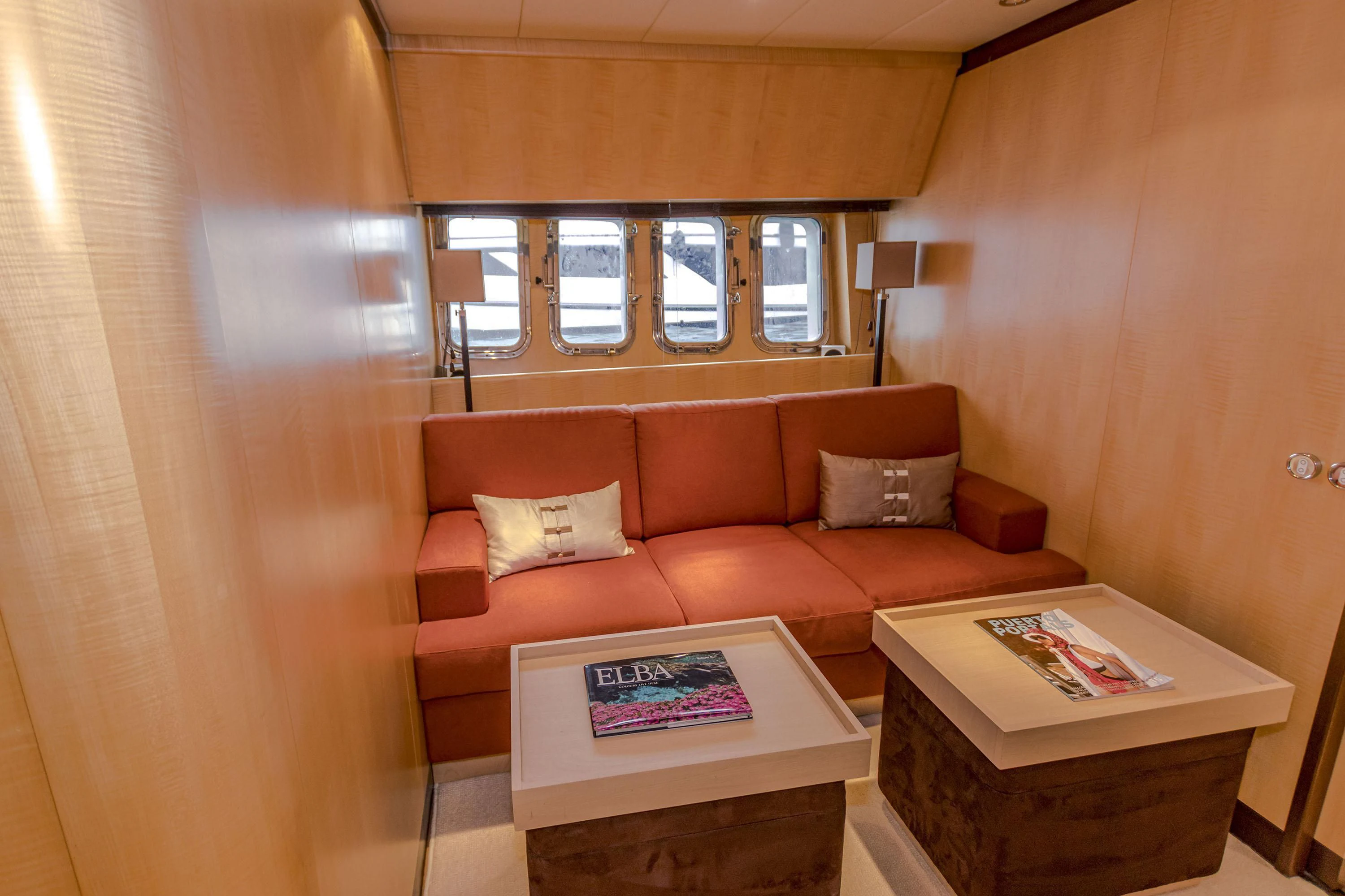 a living room with a couch and coffee table aboard VELOCE Yacht for Sale
