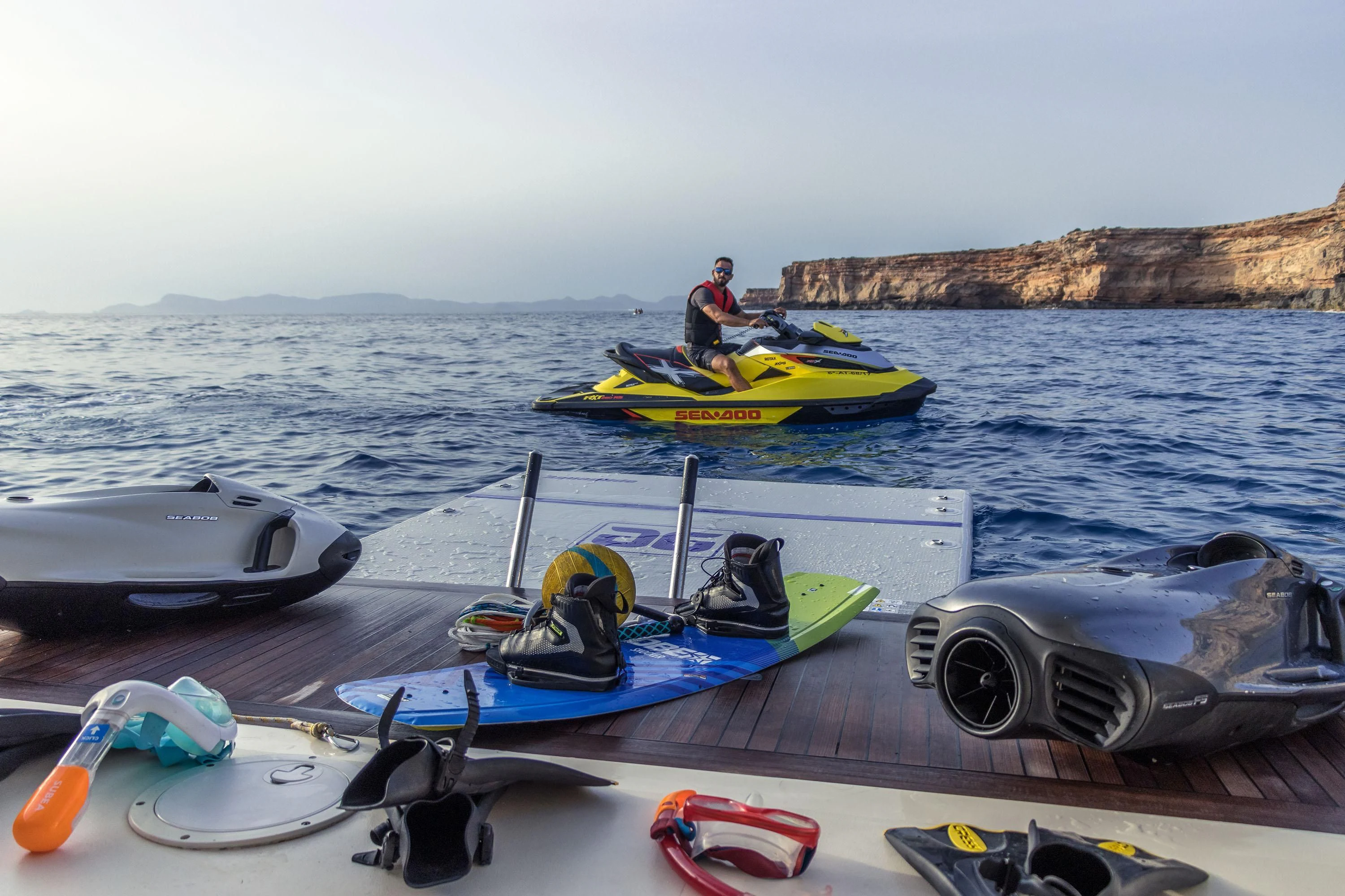 a group of people in a row boat on the water aboard VELOCE Yacht for Sale