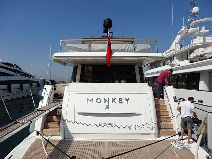 a boat with a sign on the front aboard MONKEY Yacht for Sale