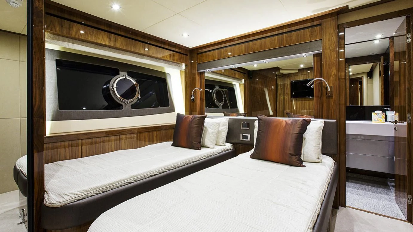 a hotel room with a bed and a television aboard GELATO Yacht for Sale