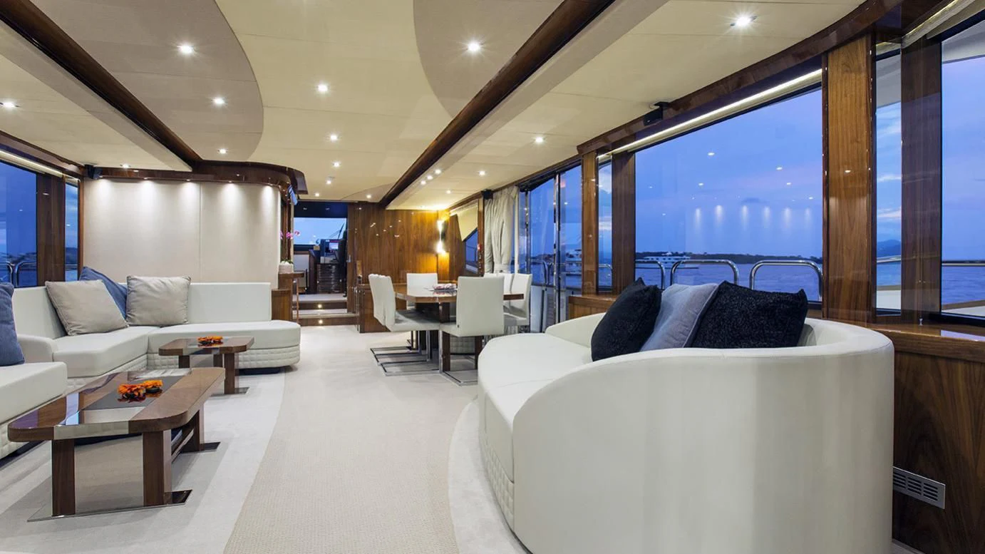 a room with a bed and a couch aboard GELATO Yacht for Sale