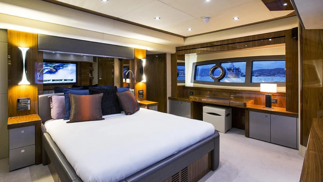 a room with a bed and a tv aboard GELATO Yacht for Sale
