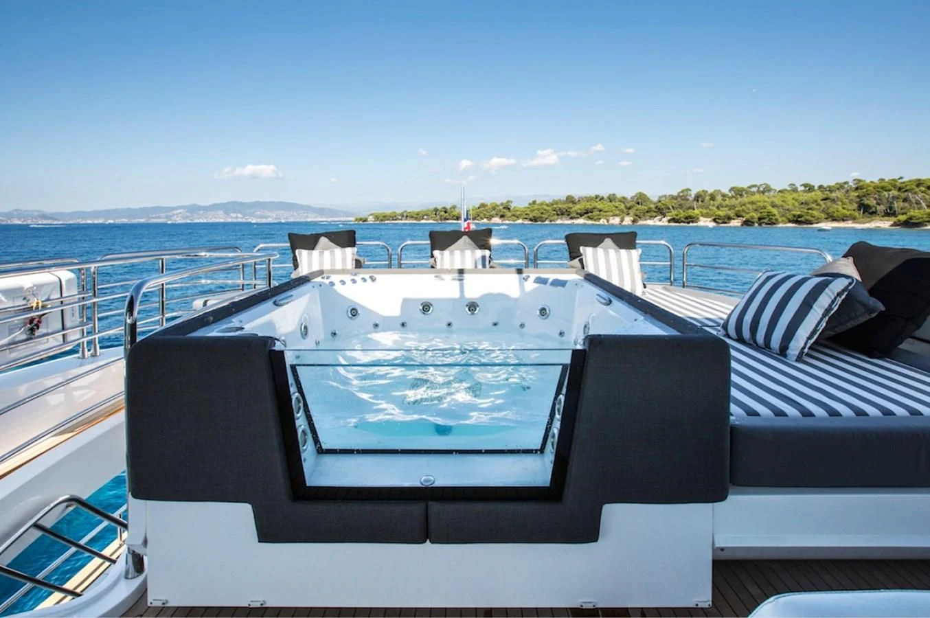 a large white boat on a body of water aboard GELATO Yacht for Sale