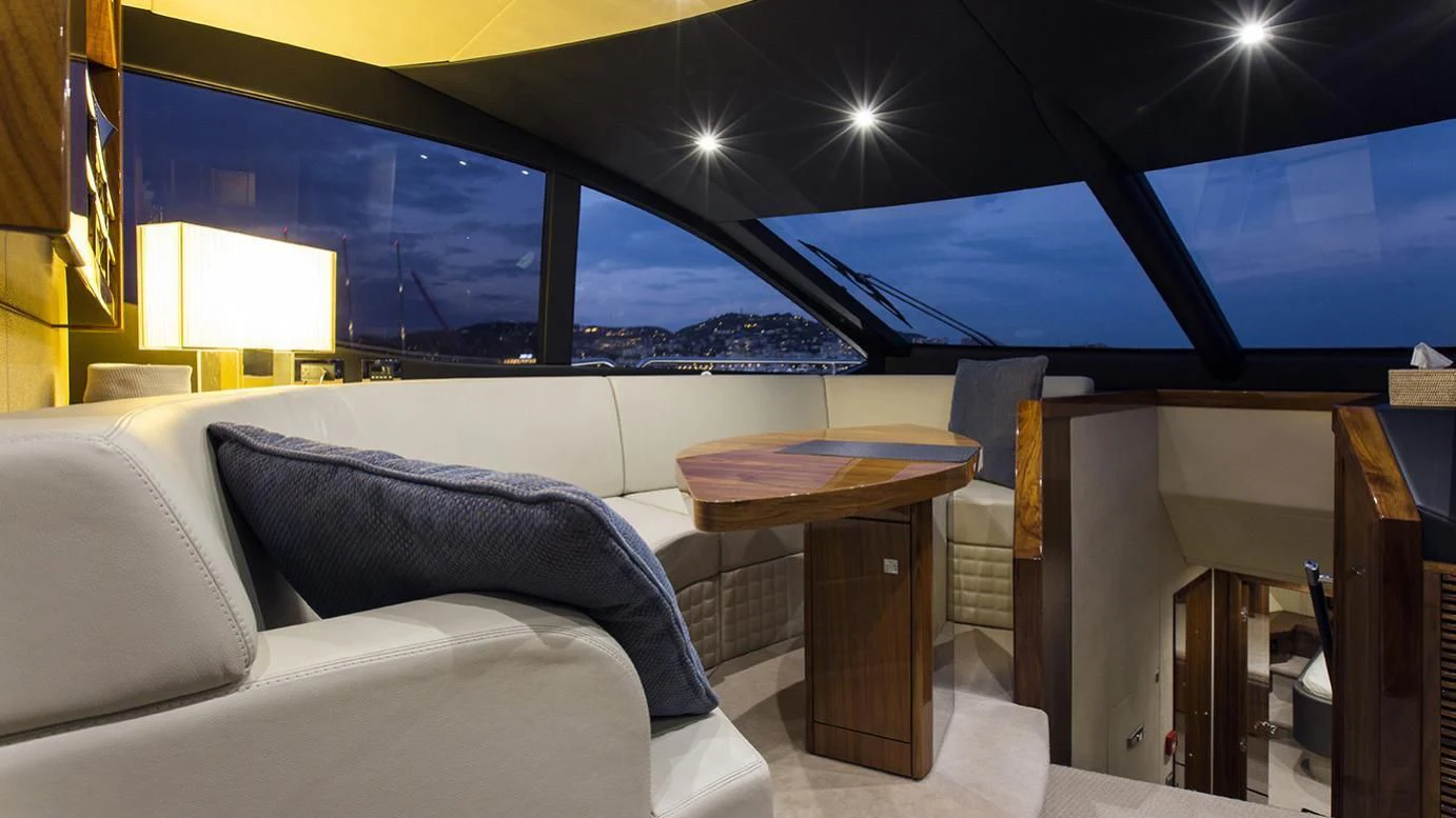a room with a bed and a table aboard GELATO Yacht for Sale