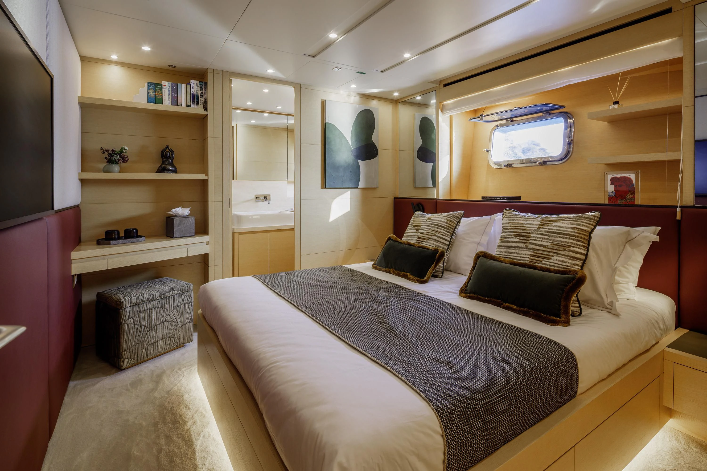 a bedroom with a bed and a tv aboard ELYSIUM Yacht for Sale