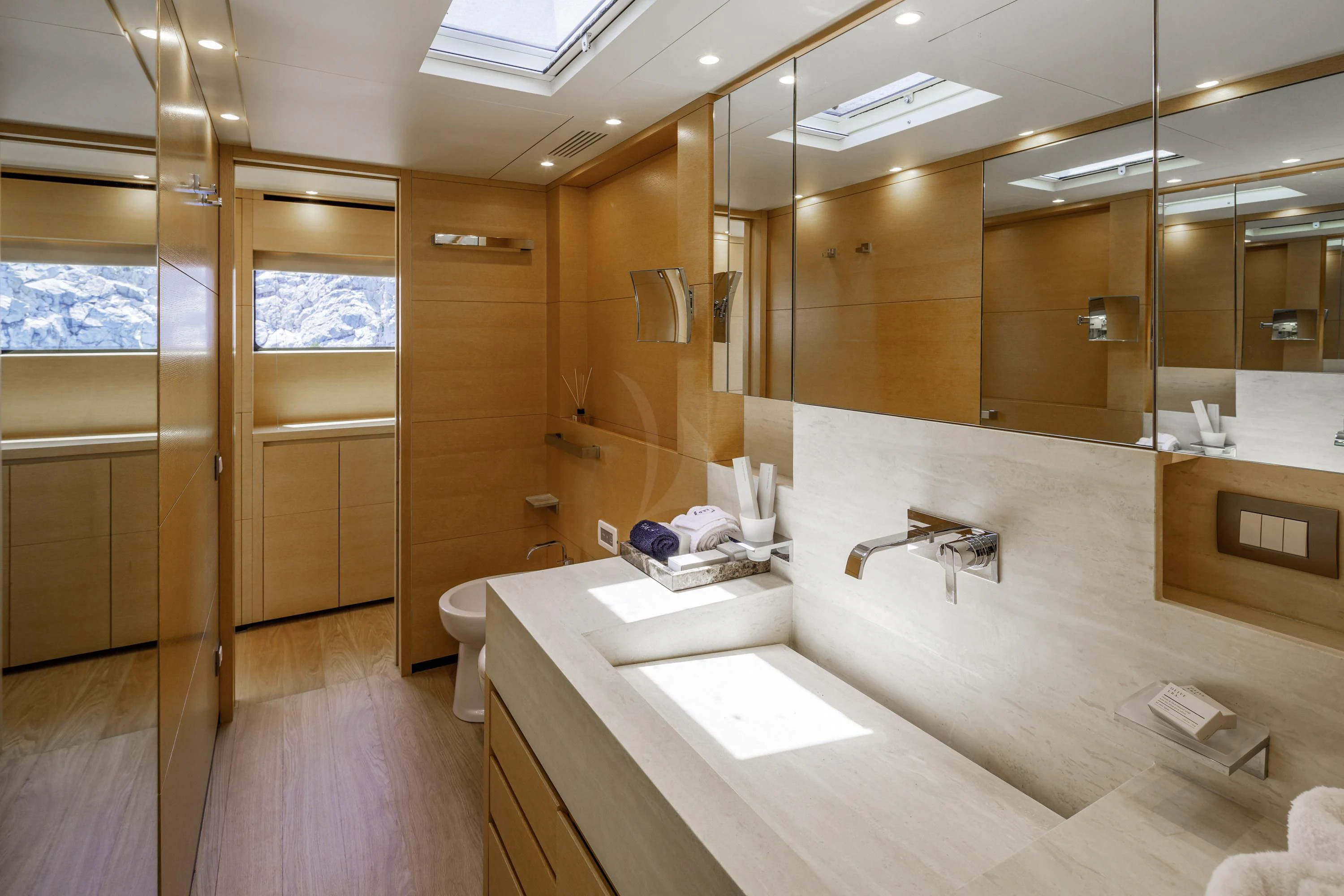 a bathroom with a large mirror aboard ELYSIUM Yacht for Sale