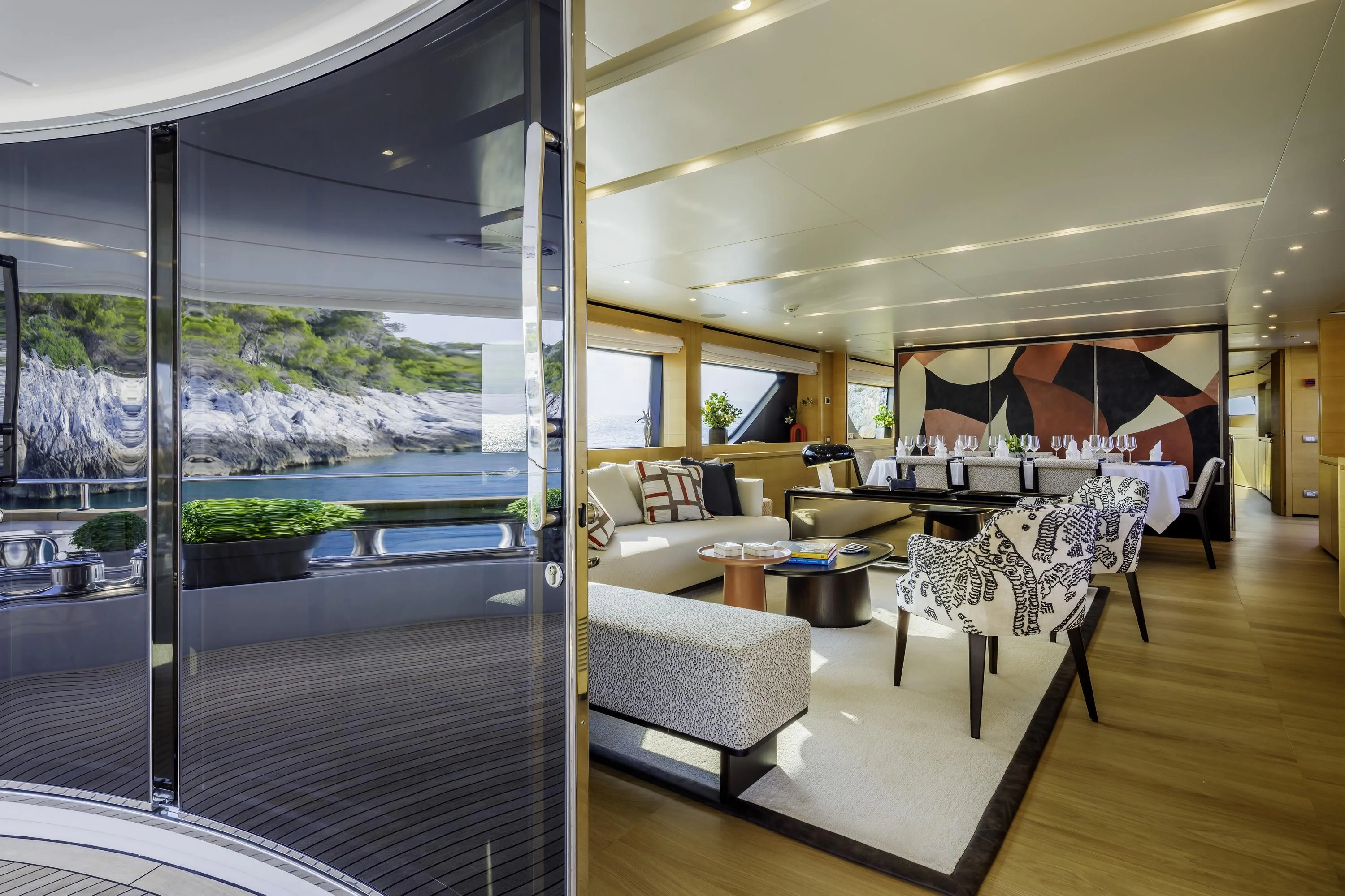 a living room with a large glass window aboard ELYSIUM Yacht for Sale