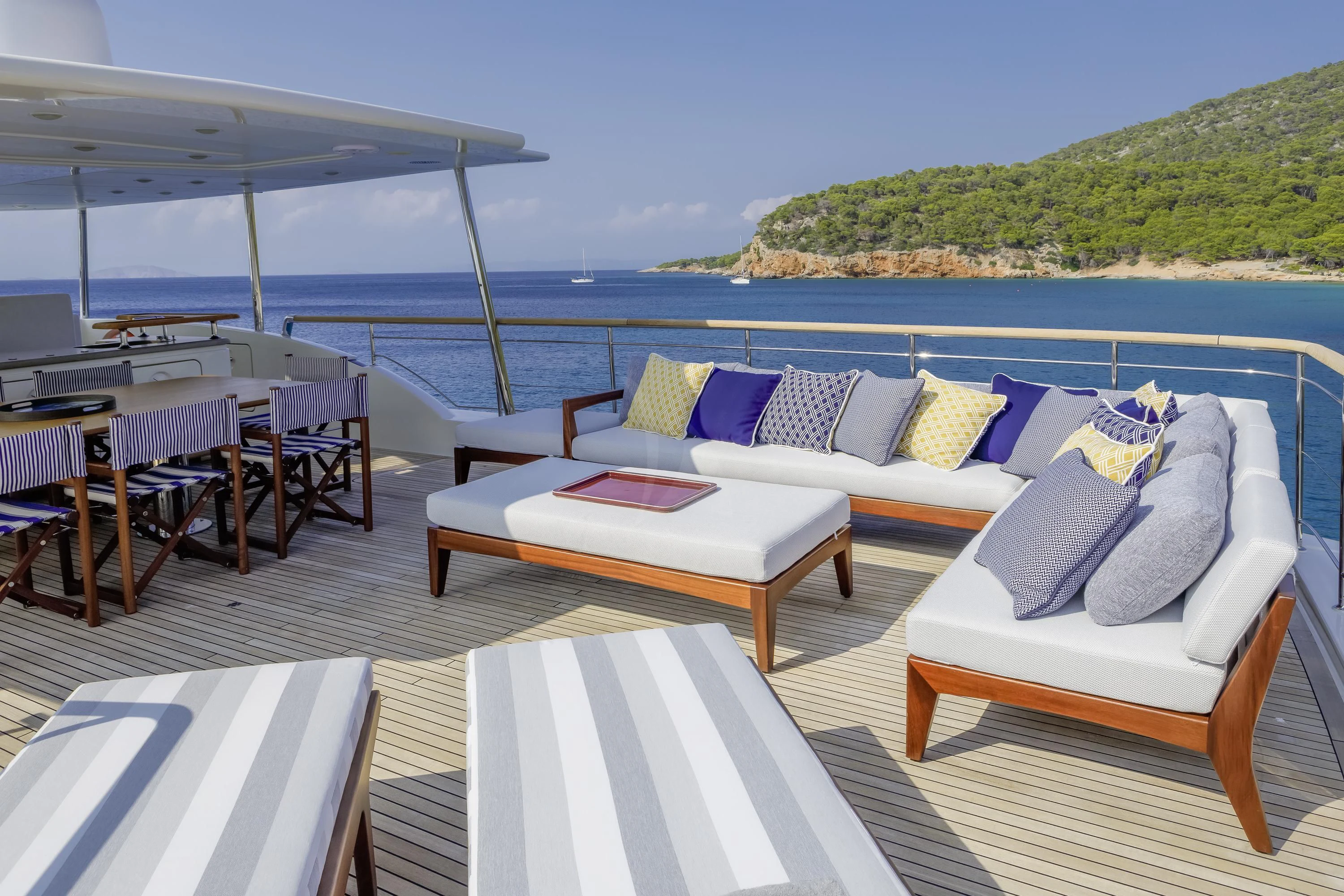 a deck with chairs and tables on it aboard ELYSIUM Yacht for Sale