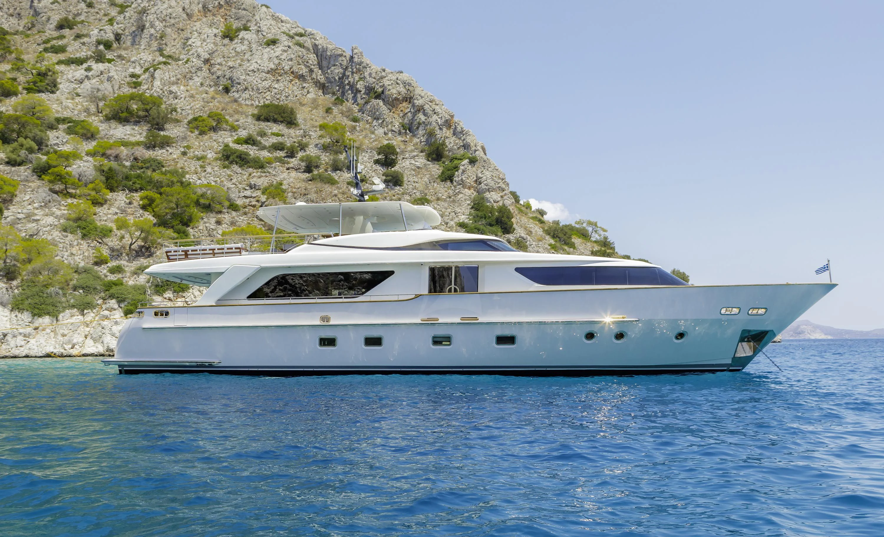 a white yacht on the water aboard ELYSIUM Yacht for Sale