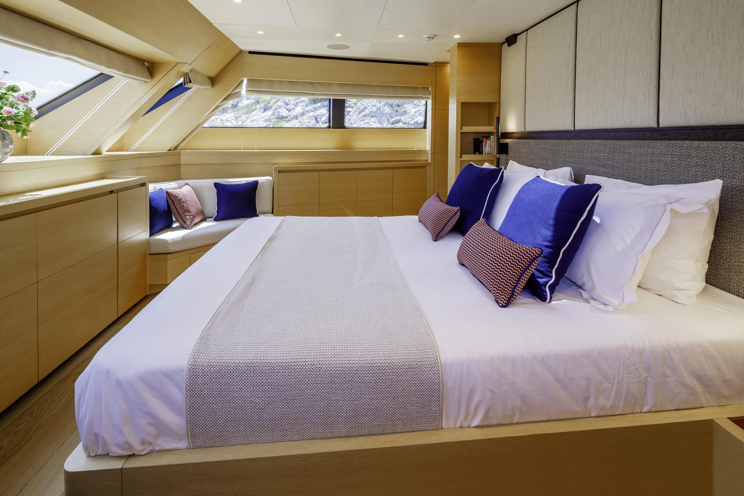 a bed with white sheets aboard ELYSIUM Yacht for Sale