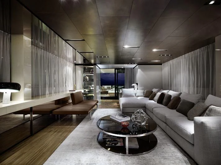 a living room with a couch and a coffee table aboard ELYSIUM Yacht for Sale