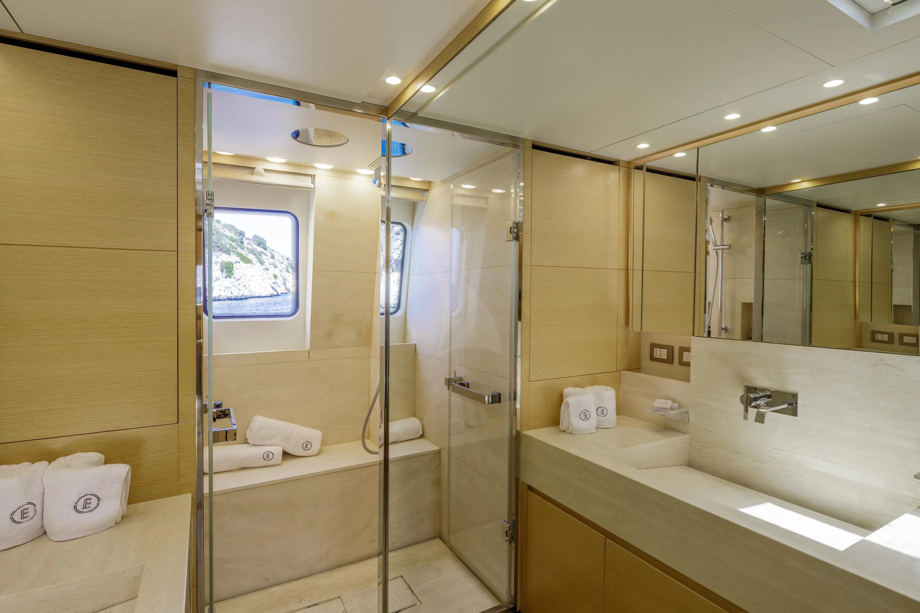 a bathroom with a glass shower aboard ELYSIUM Yacht for Sale