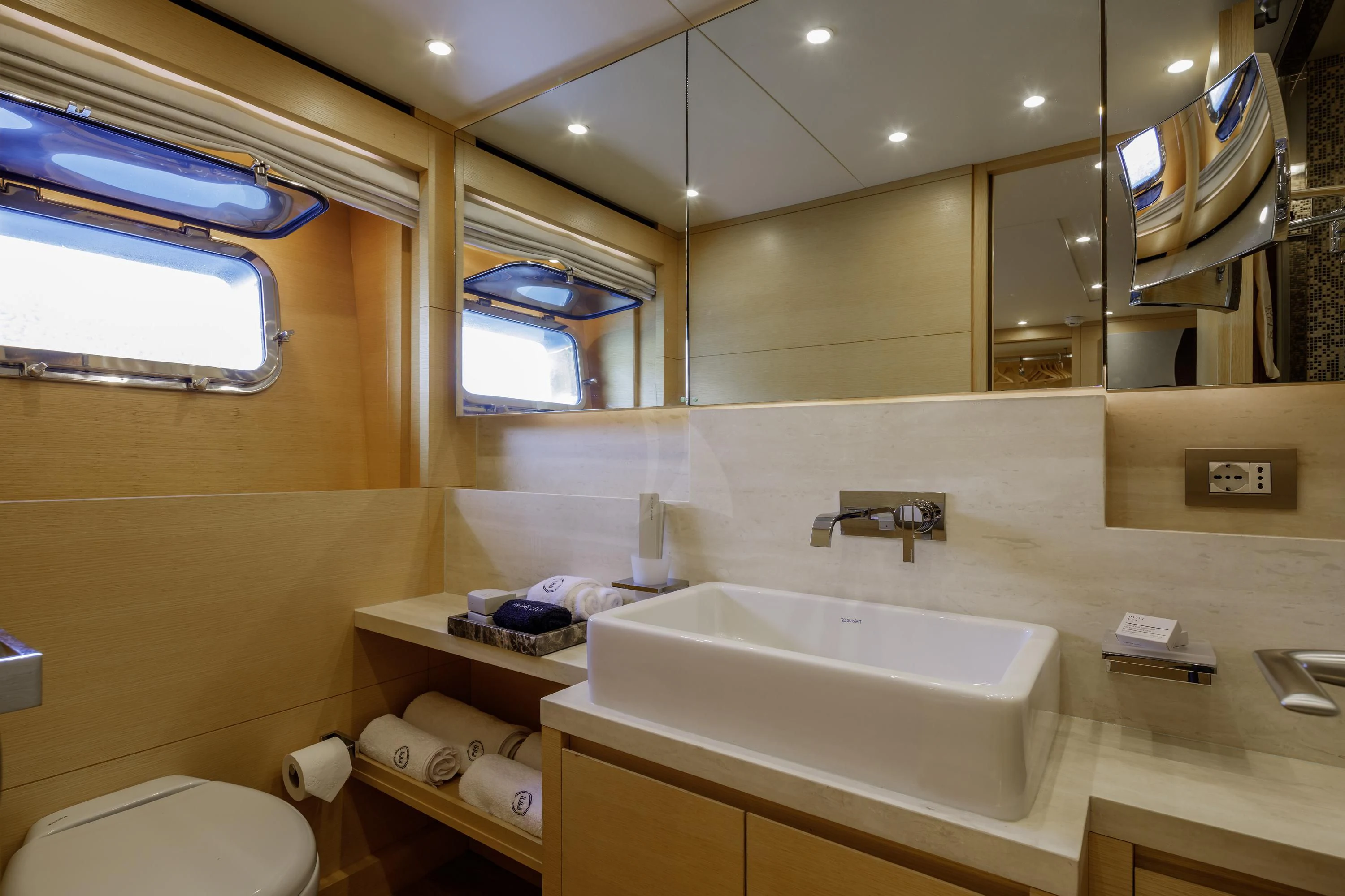 a bathroom with a sink and a mirror aboard ELYSIUM Yacht for Sale