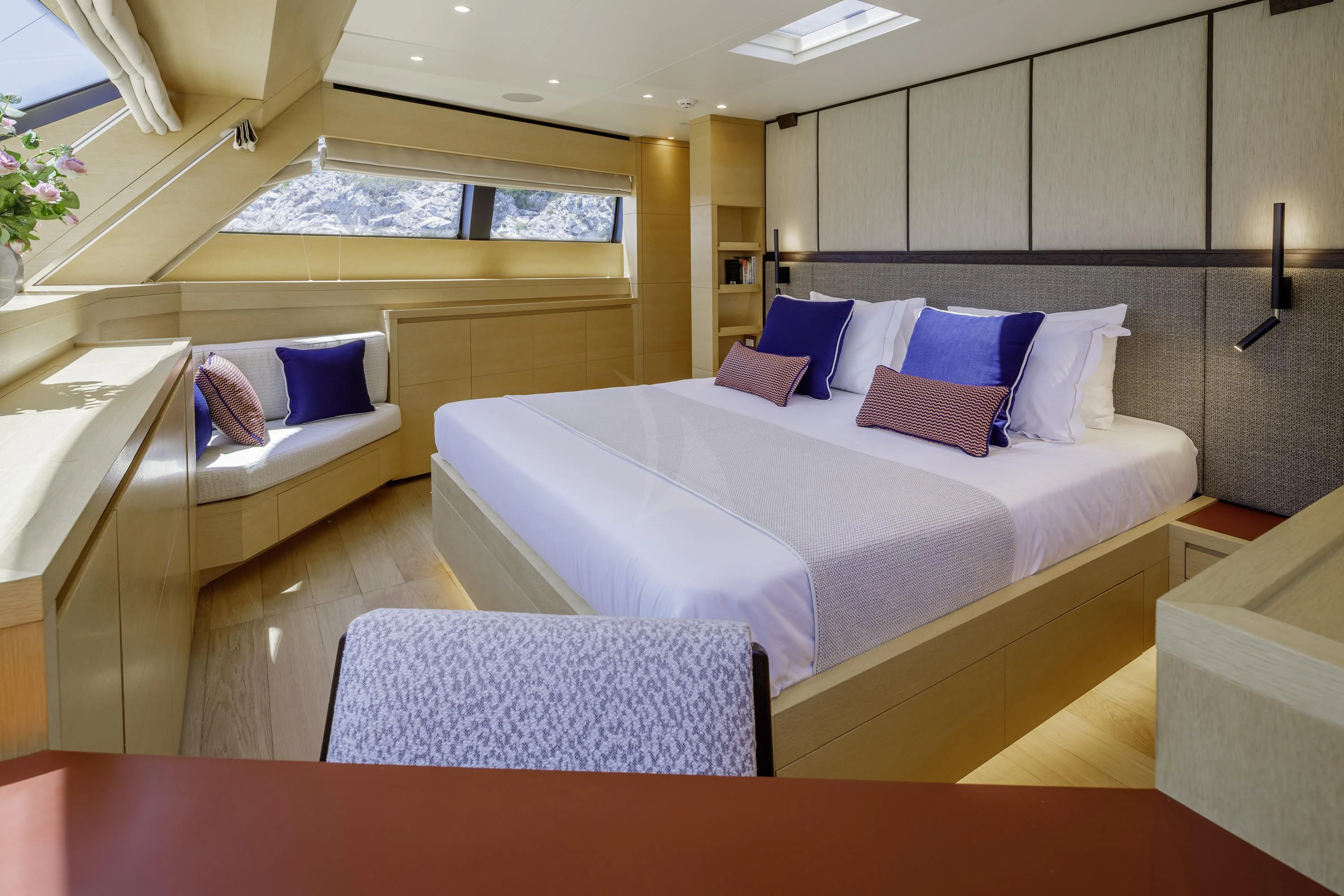 a bed with a white sheet and pillows aboard ELYSIUM Yacht for Sale