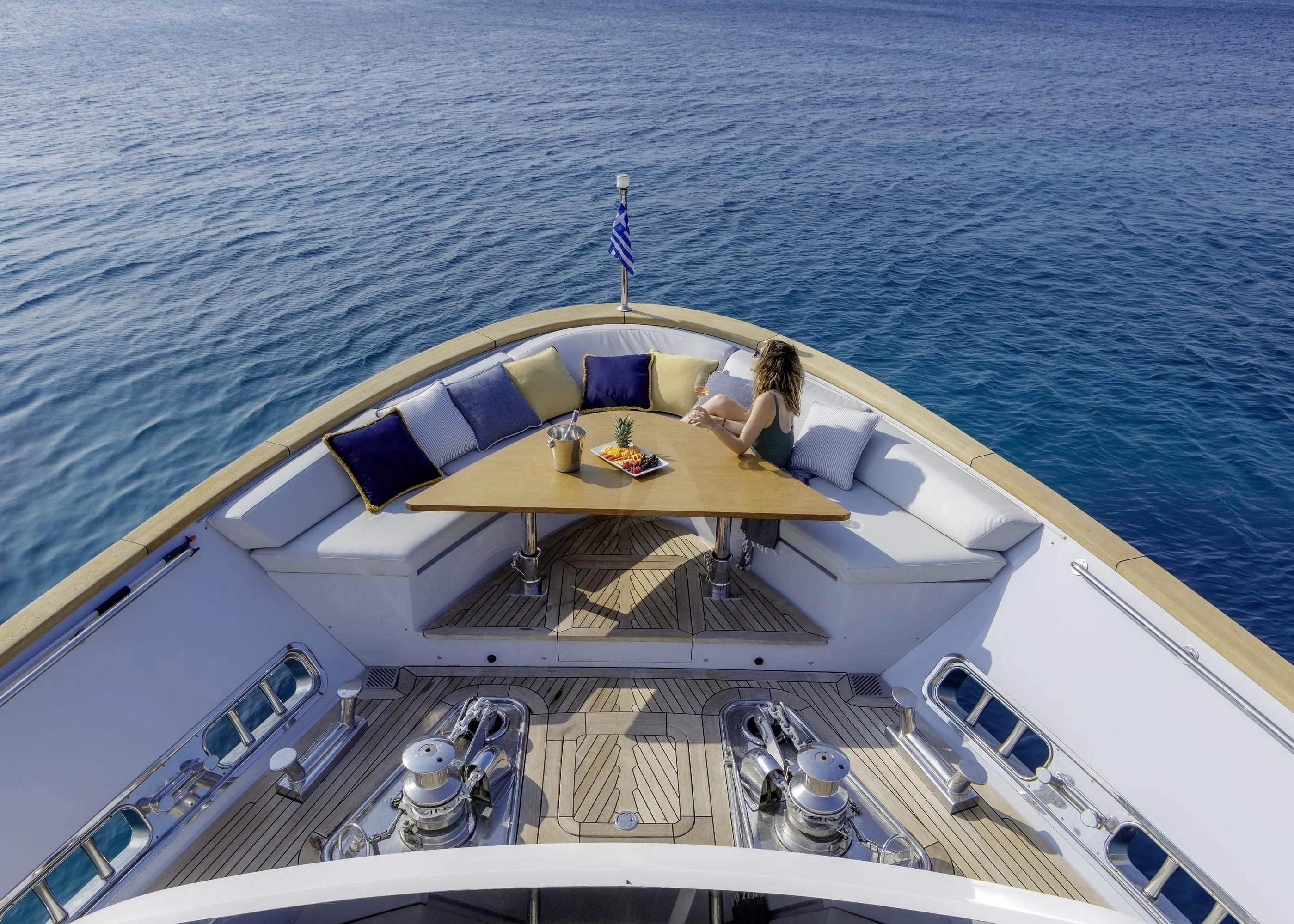 a person sitting on a boat aboard ELYSIUM Yacht for Sale