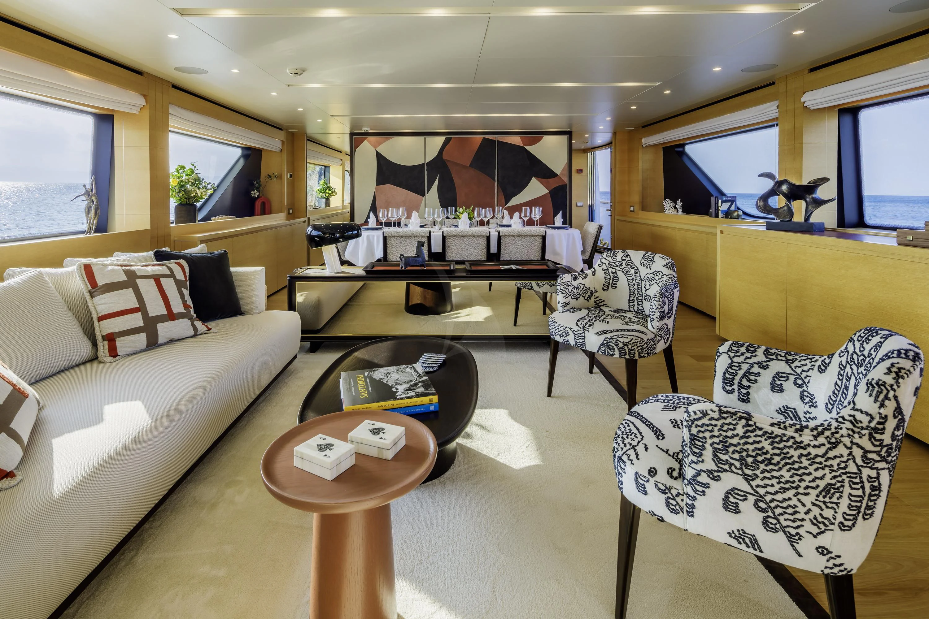 a living room with a couch and a coffee table aboard ELYSIUM Yacht for Sale