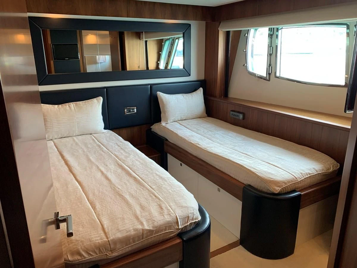 a bed in a room aboard KAPUSHA Yacht for Sale