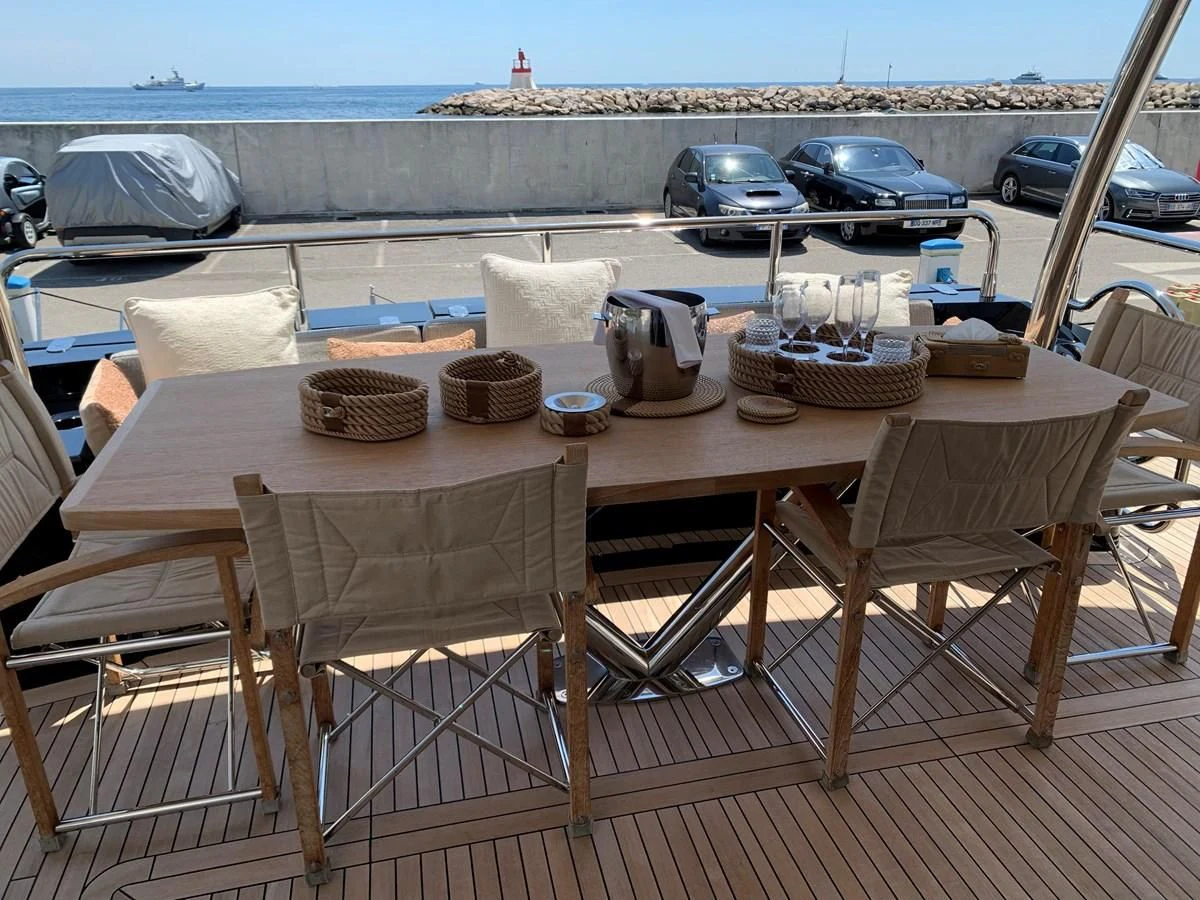 a table with plates and cups on it aboard KAPUSHA Yacht for Sale