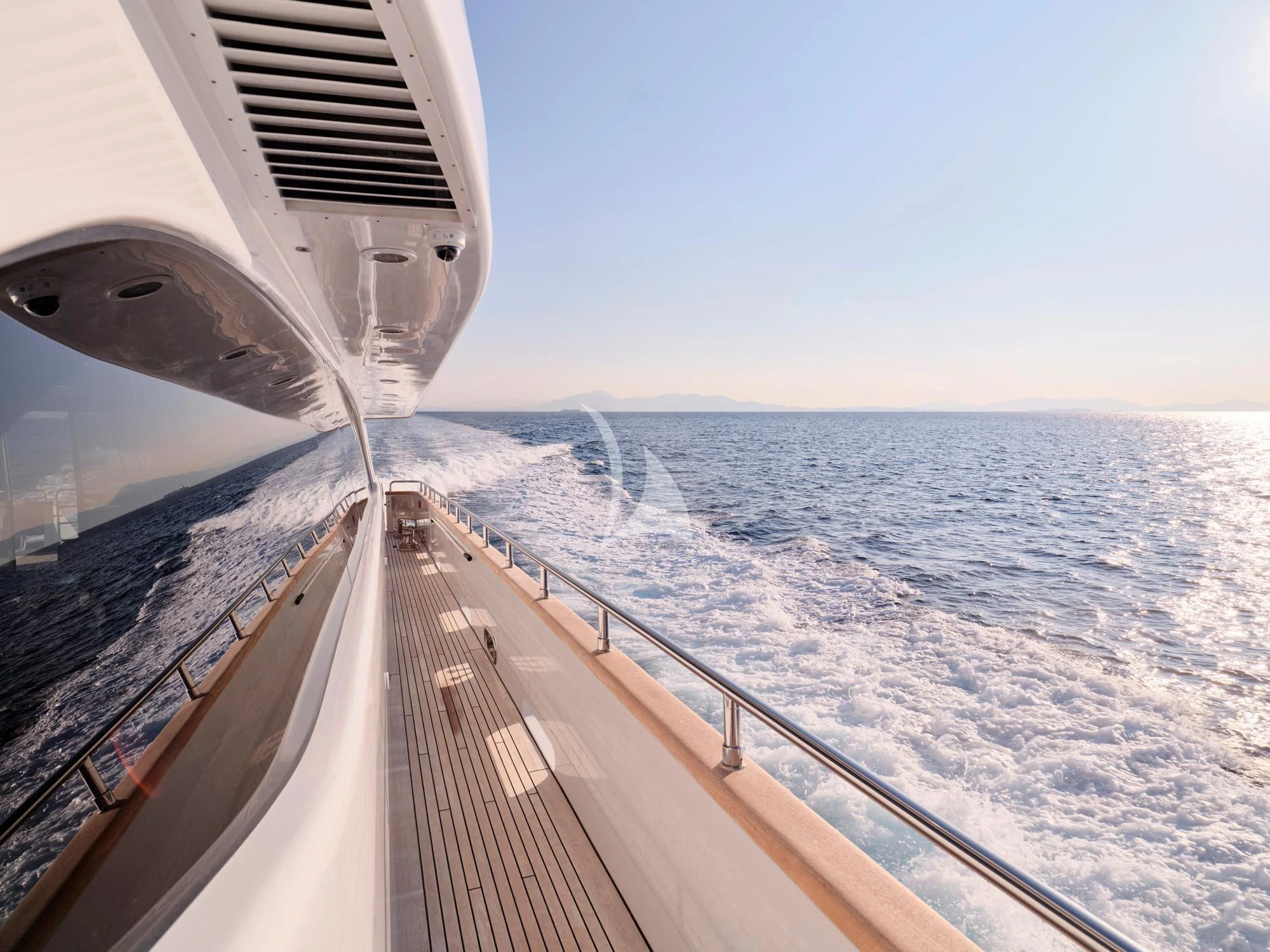 a view of the ocean from the deck of a plane aboard HELIOS Yacht for Charter
