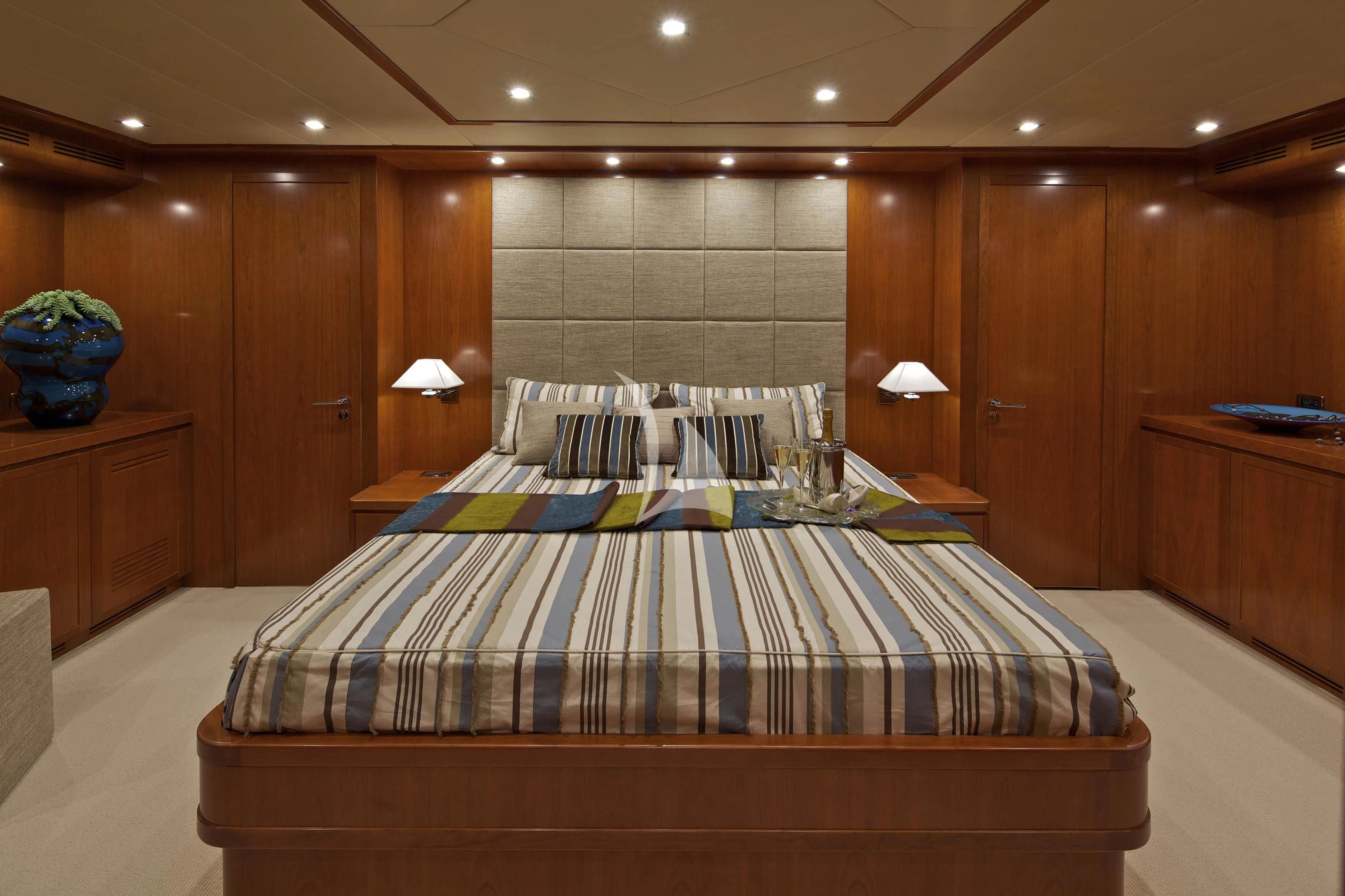 a bed in a room aboard HELIOS Yacht for Charter